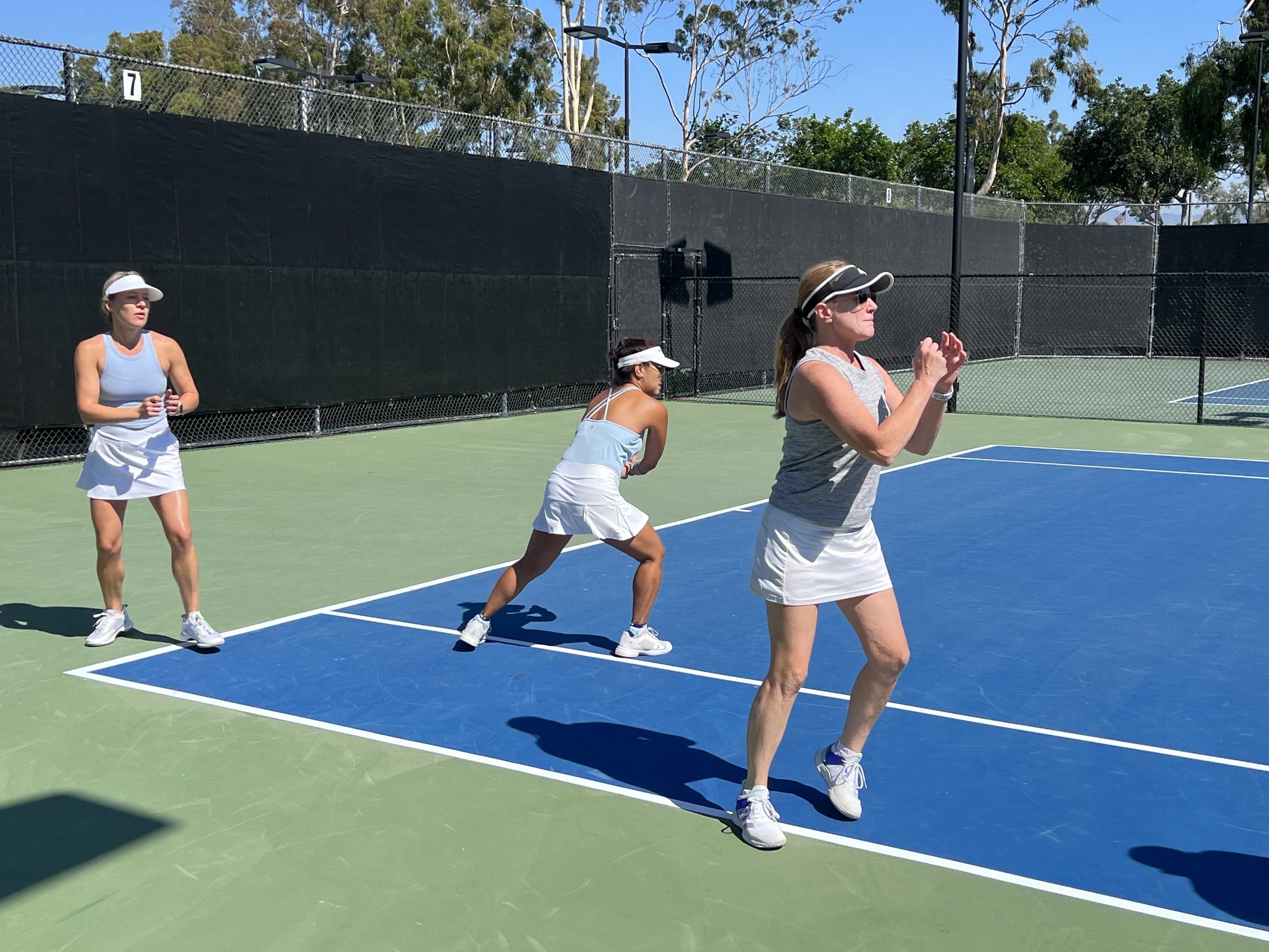 Adult doubles at night on outdoor courts