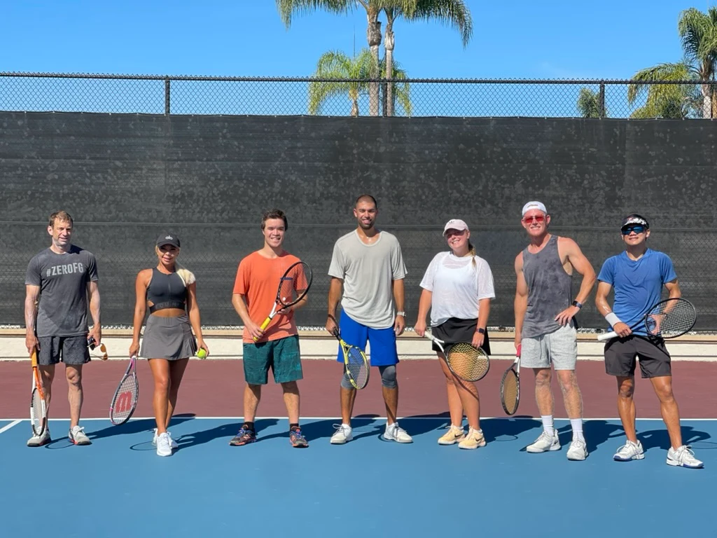 Seven LBTA players in a lineup on an outdoor court — community built on respect