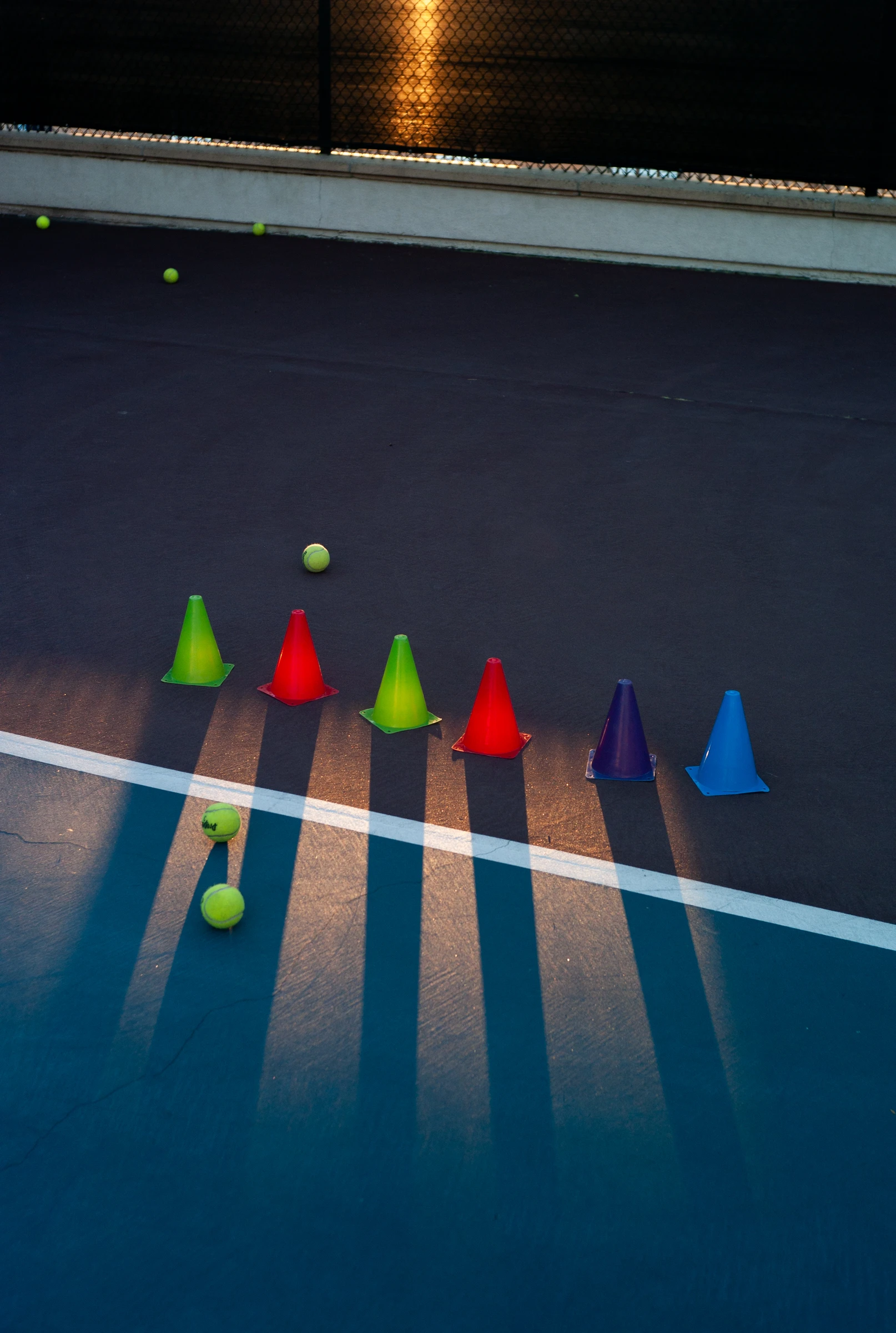 Alta Laguna tennis courts with shadows across the playing surface